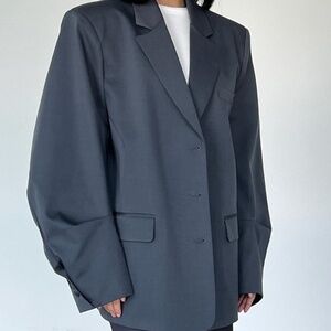 Gray oversized blazer with wide sleeve. Woman blazer, suit jacket.